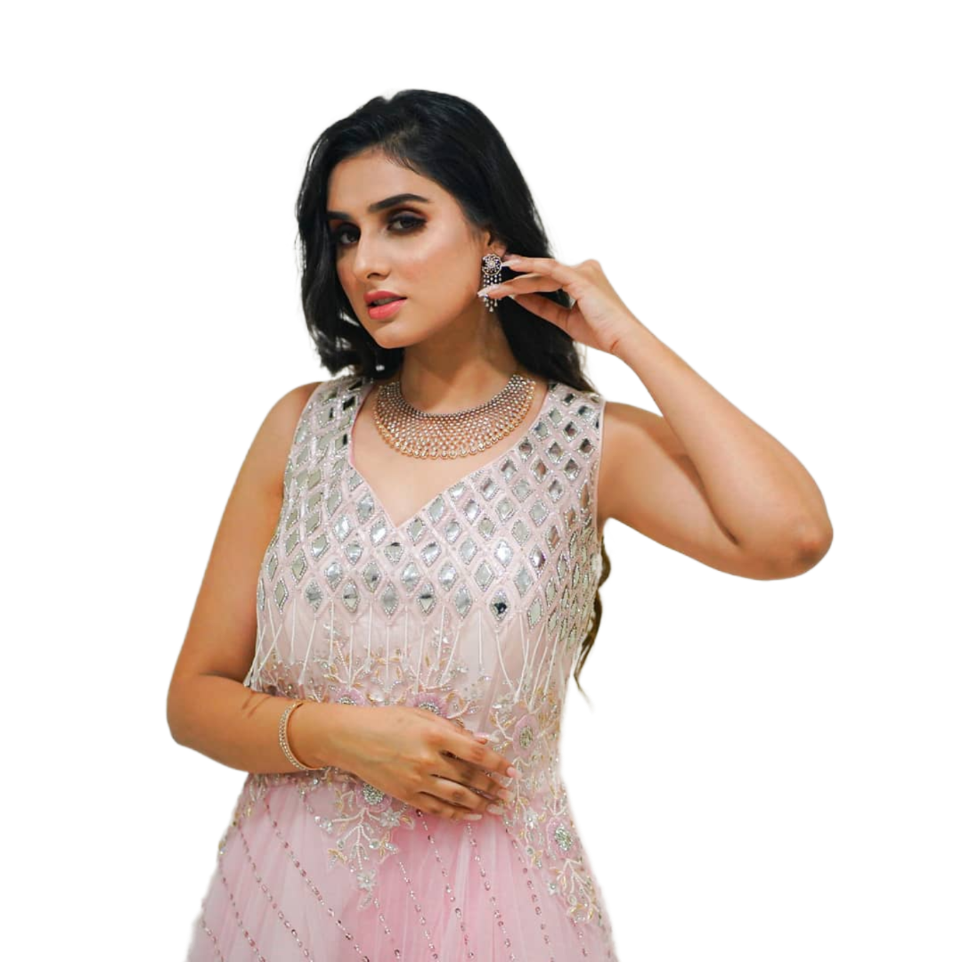 Nikita Chaturvedi in a pink embellished outfit with a golden aura